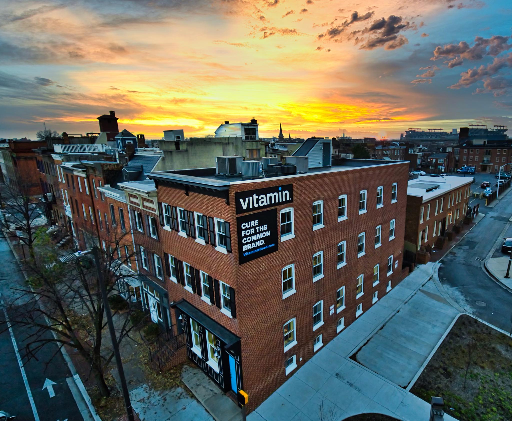 POV photo of Vitamin building at sunset